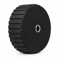 Wheel 52 black solid face with metal-lined hub opening and horizontal ridges on outer tyre